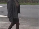 Passionate middle-aged French spouse walking semi naked outdoor and flashing nude