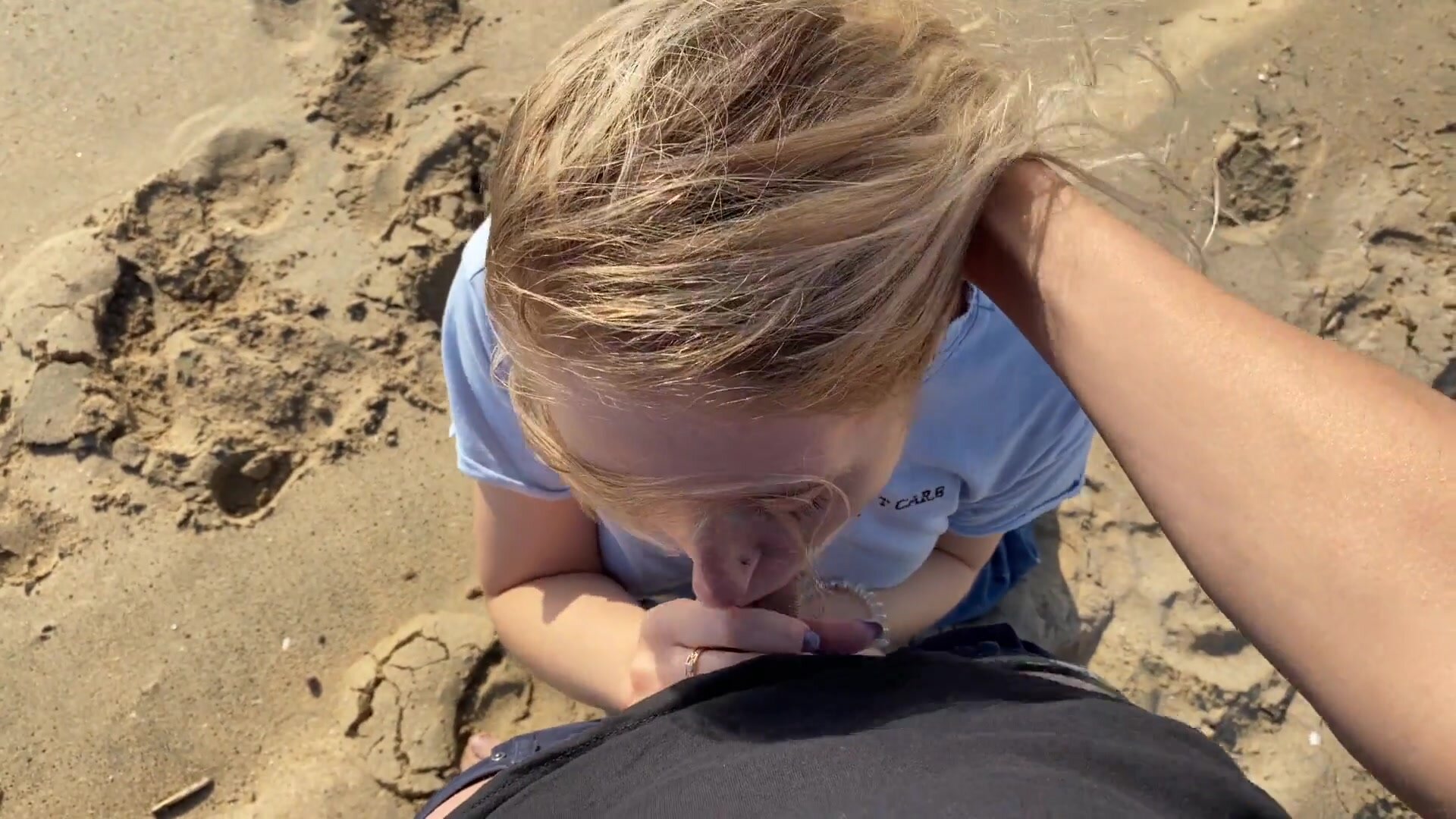 Angelic oral sex at the beach with excited blonde pic